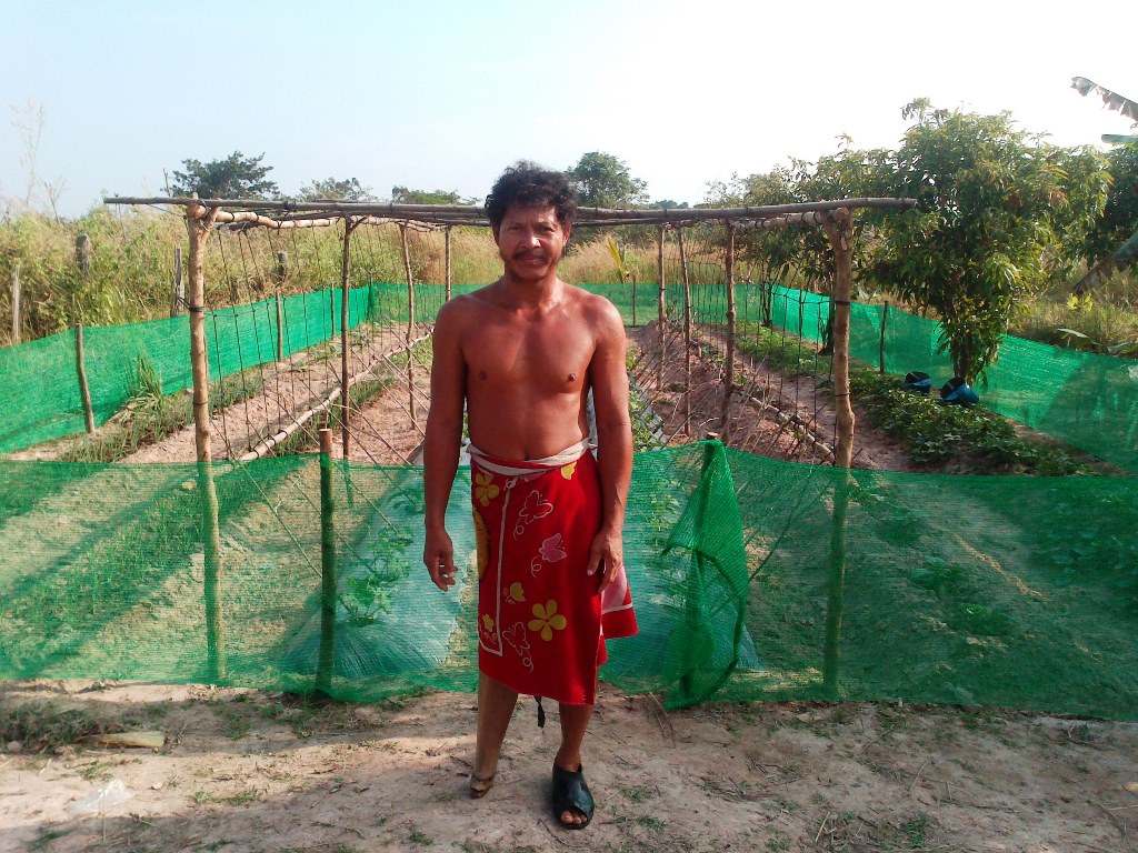 Yeow Chiek in front of his 3 weeks old garden