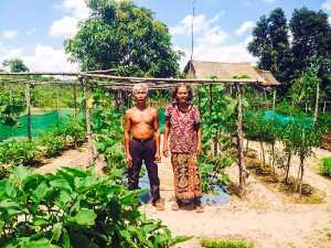 SOL and his wife with their FAITH Organic vegetable garden