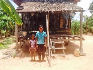 SHR and his son in front of their house