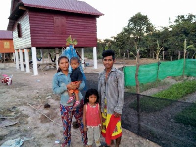 KN and his family in front of their new home