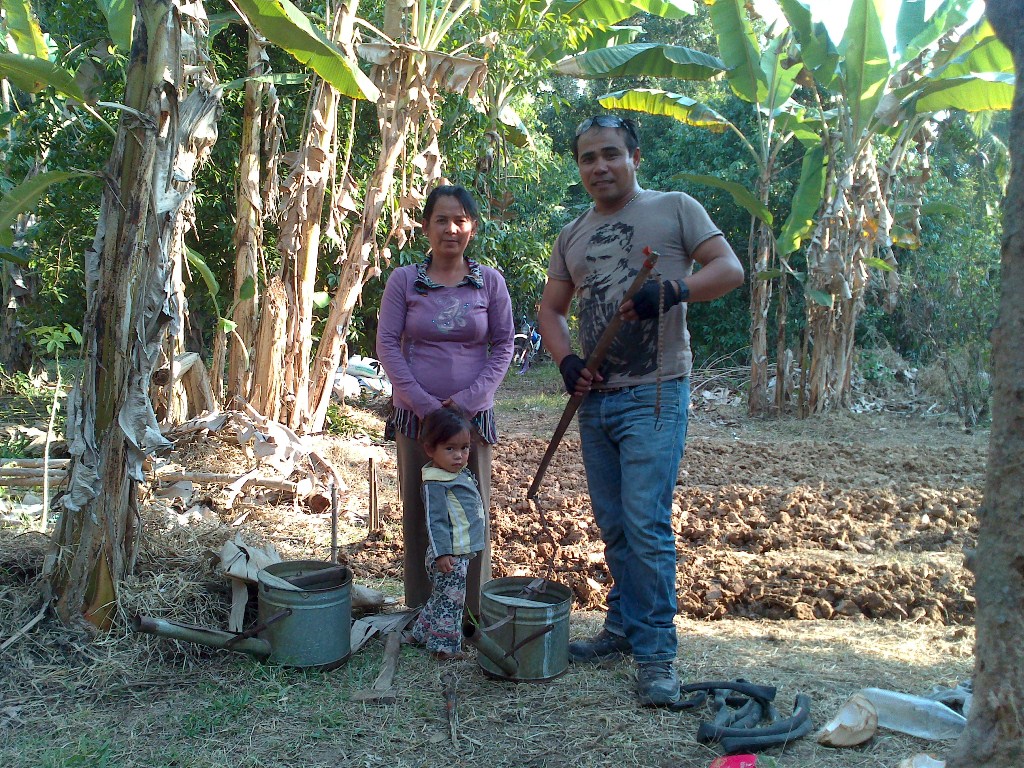 Y family mother and her grand-daughter with Rey building garden - 18 Jan 2013