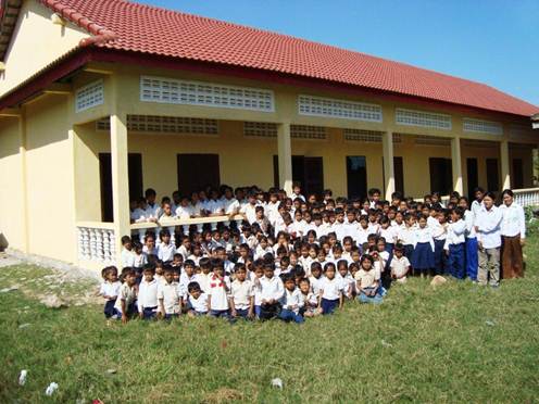 Children outside three new classrooms
