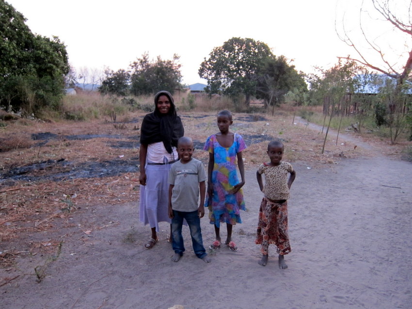 SM with her children in front of the proposed garden area