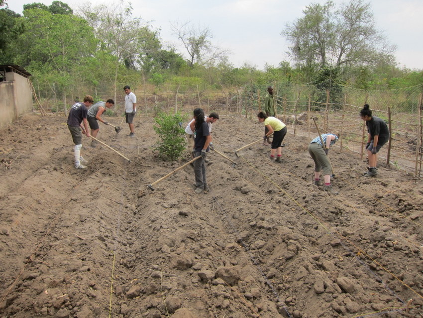 Moza and students working hard to prepare the garden.