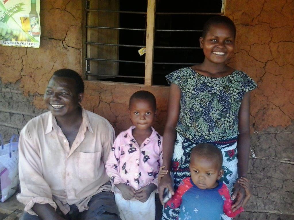 MMC family picture in front of their house.