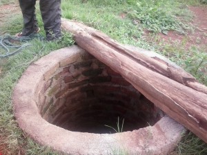 The well the family reinforced using funds from their vegetable garden.