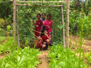 NSV's wife and children in thier FAITH organic vegetable garden