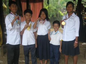 Lai children with the gold medal