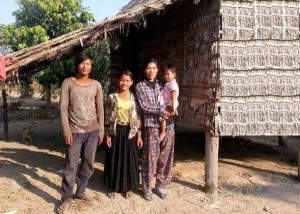 PMI and his family in front of their home