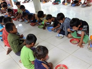 Children enjoying their rice porridge