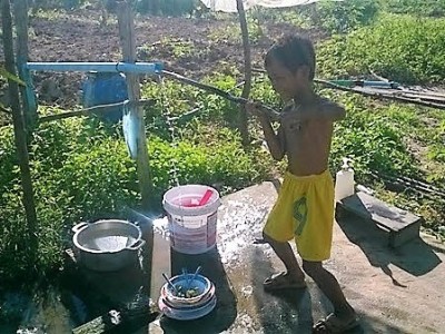 WMT's son pumping water from their well